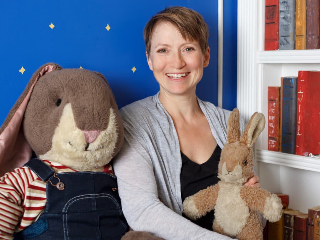 Kathleen Rea with rabbit toys